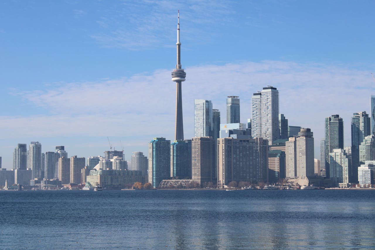 Toronto skyline with the iconic CN Tower and waterfront view.